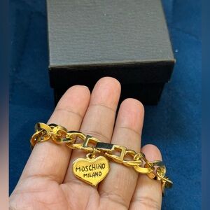 MOSCHINO Gold Plated Bracelet with a Moschino Milano engraved heart charm